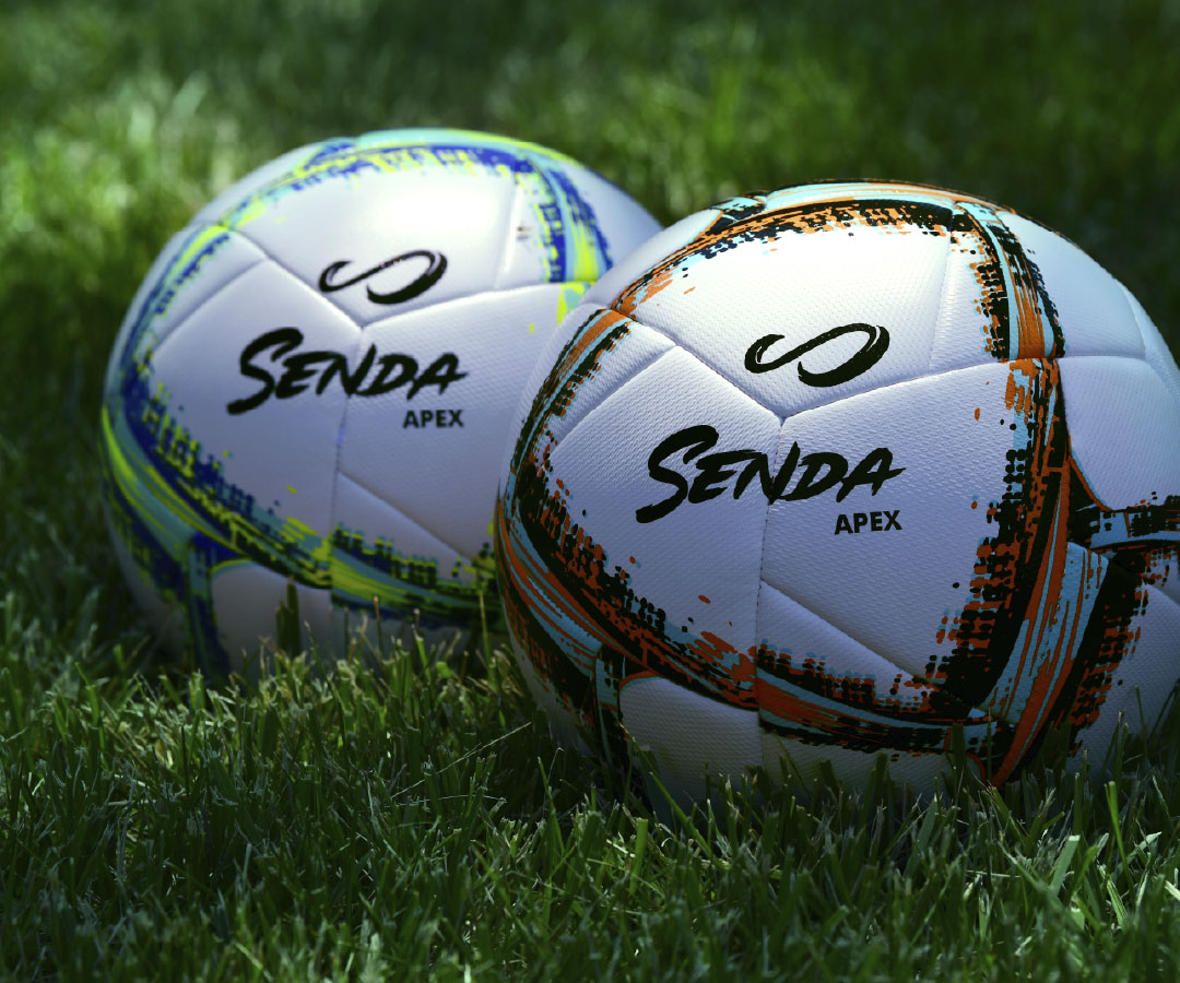 Two Senda Apex soccer balls on grass