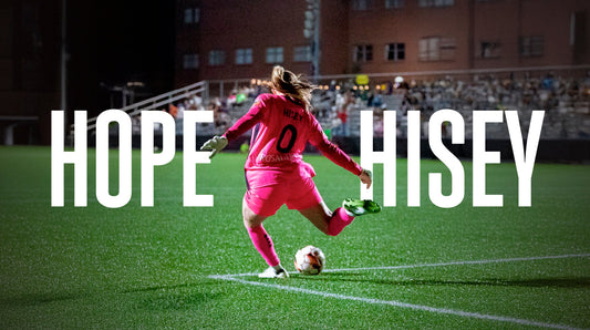 Soccer player in pink uniform kicking a ball on a field with 'Hope Hisey' text overlay.