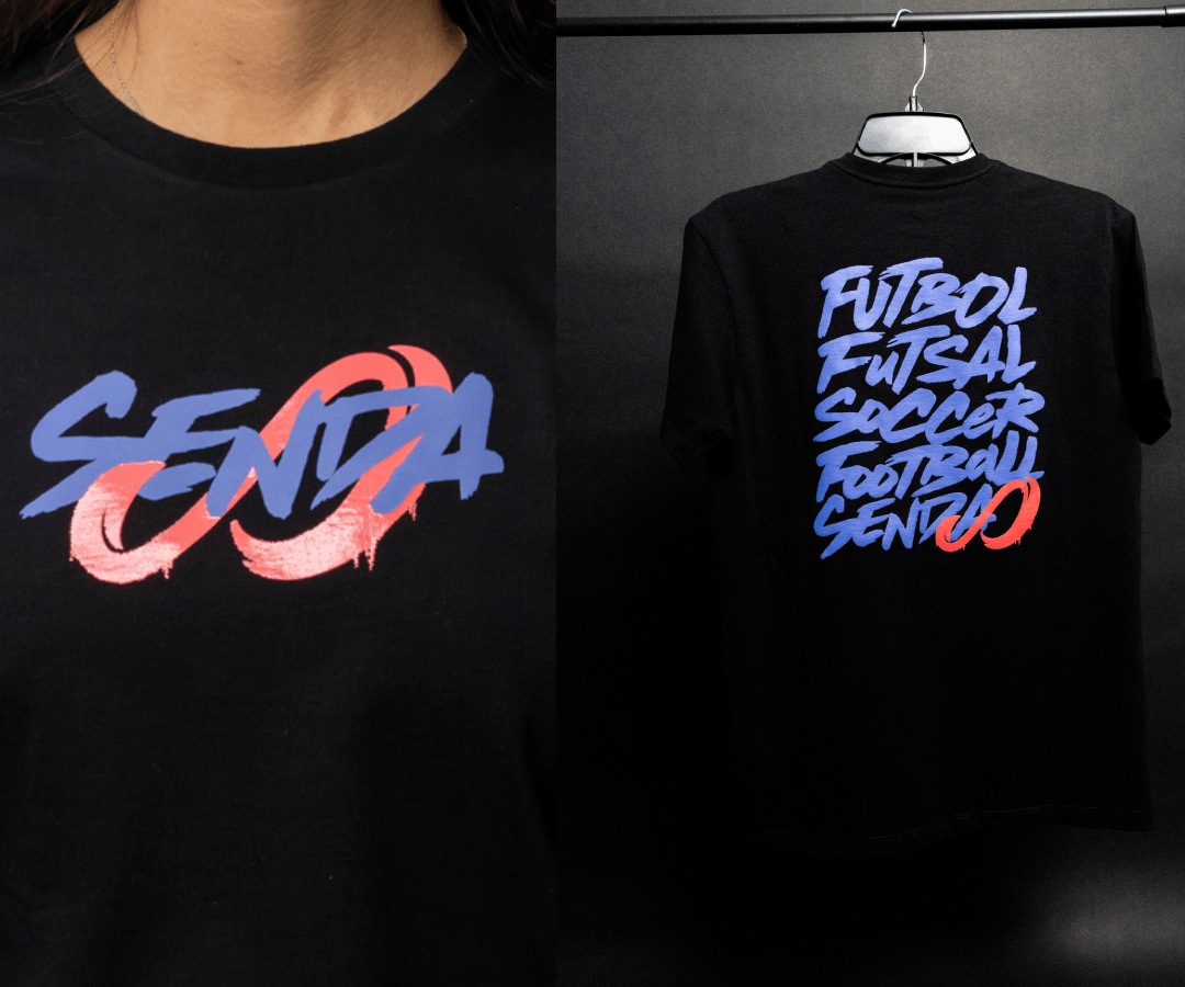 Black t-shirt with colorful text design on a dark background. Senda Lifestyle Apparel Collection