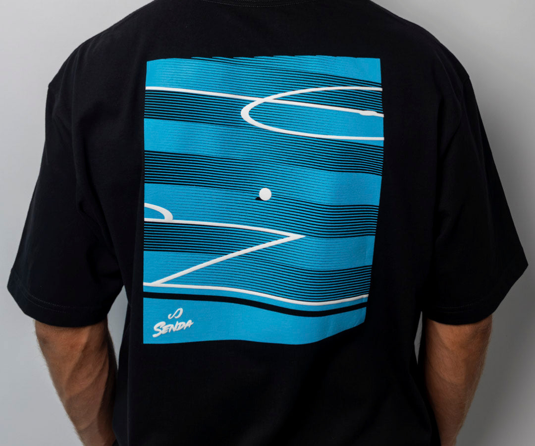 Black t-shirt with blue and white abstract design on the back, on a plain background. Senda Lifestyle Apparel Collection
