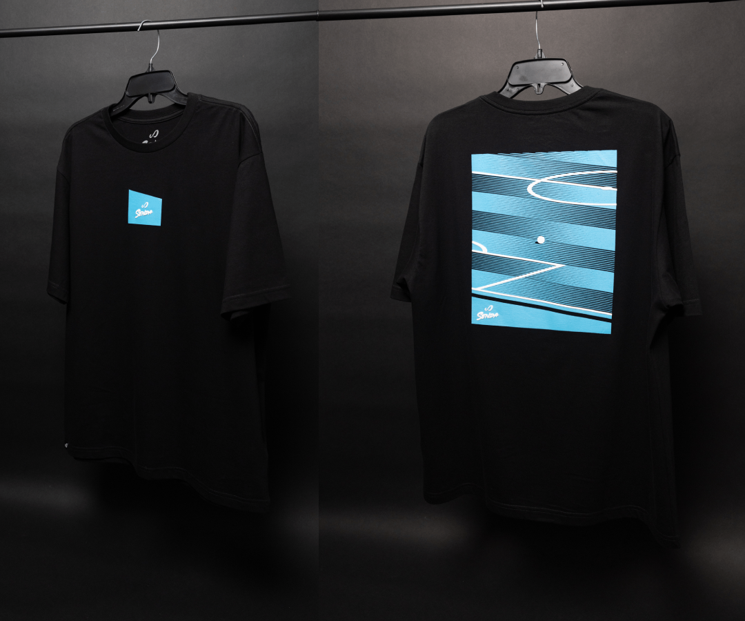 One black t-shirts with two different angles with print both back and front  on hangers against a dark background. Senda Lifestyle Apparel Collection