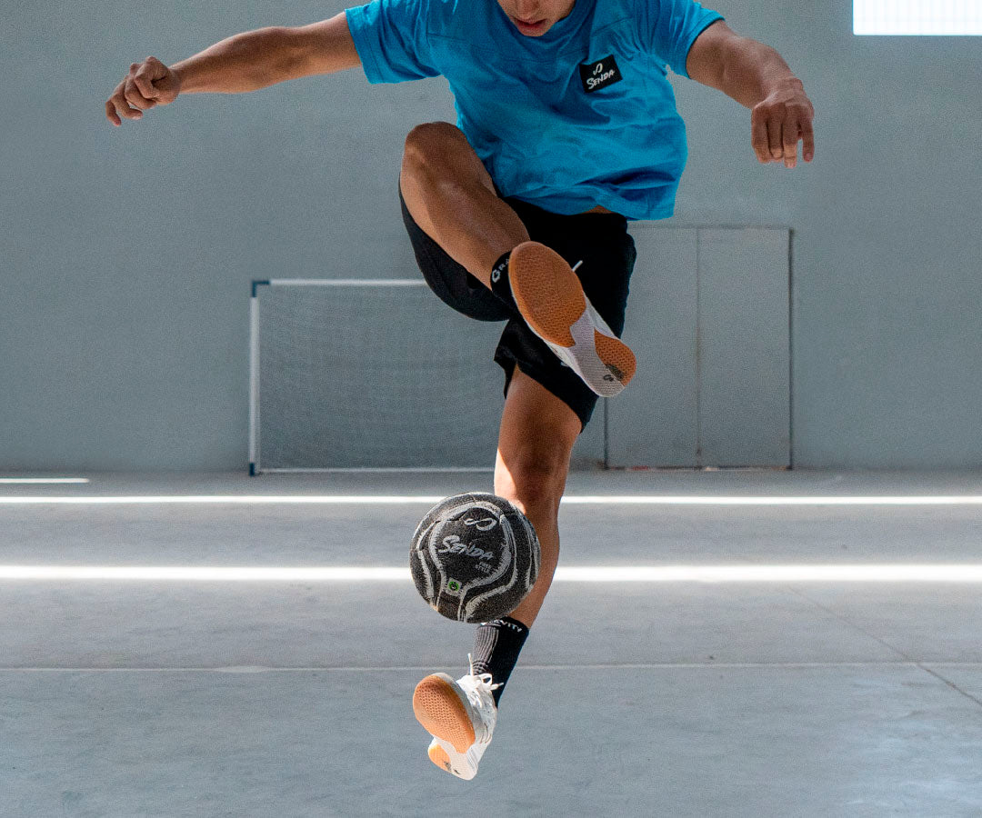 Person playing with a ball in an indoor setting