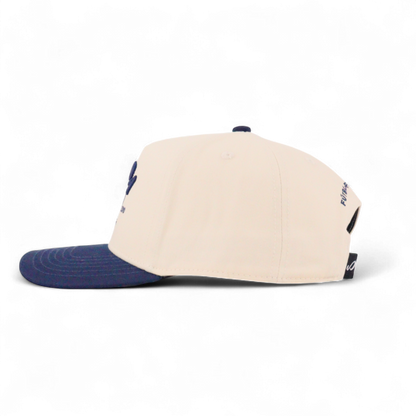 Beige and navy cap on a white background