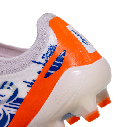 Close-up of a Senda sports shoe with orange and blue design on a white background